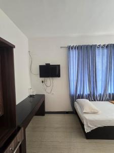 TV a/nebo společenská místnost v ubytování Vue Dale Retreats Munnar + 69 fotografií