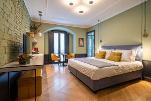 Voodi või voodid majutusasutuse Case Ospitali, KS-Suites toas