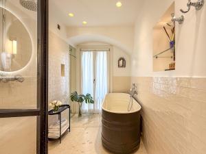 Vannituba majutusasutuses Case Ospitali, KS-Suites