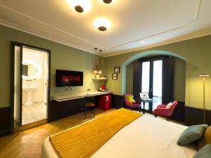 Voodi või voodid majutusasutuse Case Ospitali, KS-Suites toas