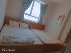 Una cama o camas en una habitación de DINO Home HACOM 2BR 2WC