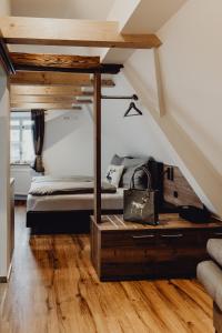 a bedroom with a bed in a attic at Stadt Land Fluss Boutique Aparthotel by Zollhaus in Forchheim +200 photos