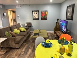 a living room with a couch and a table at Casada in Las Vegas