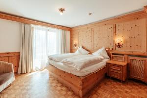 Postel nebo postele na pokoji v ubytování Biohotel Schweitzer