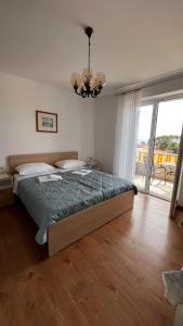Posteľ alebo postele v izbe v ubytovaní Apartment Zana