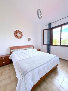 Letto o letti in una camera di Domu e Mari Sud Sardegna