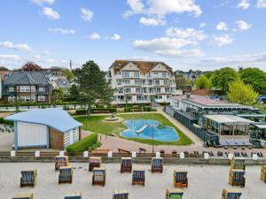 arial view of a resort with a pool and a building at Ferienwohnung Strandliebe Laboe in Laboe