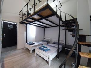 Postel nebo postele na pokoji v ubytování DM Hostel and Apartments