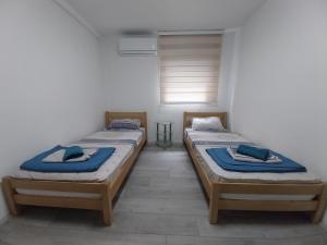 Postel nebo postele na pokoji v ubytování DM Hostel and Apartments