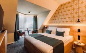 Posteľ alebo postele v izbe v ubytovaní Aqua Hotel Termál