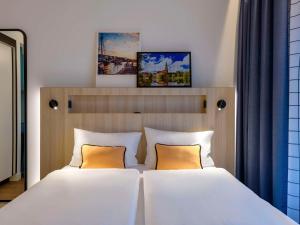 Postel nebo postele na pokoji v ubytování Aparthotel Adagio Access Kiel City