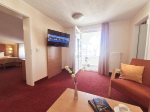 TV a/nebo společenská místnost v ubytování Hotel Villa Meeresgruss