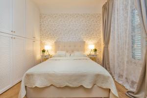 Posteľ alebo postele v izbe v ubytovaní Apartments & Rooms Perla