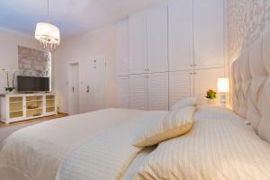Posteľ alebo postele v izbe v ubytovaní Apartments & Rooms Perla