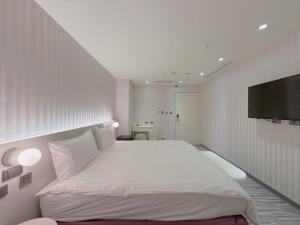 Letto o letti in una camera di 在家行旅 南西館
