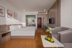 TV a/nebo společenská místnost v ubytování ELC Da Nang Hotel
