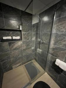 a bathroom with a shower with a glass door at Apartments Fishers in Vodice +118 photos