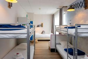 Postel nebo postele na pokoji v ubytování Hôtel Le Grand Barnum