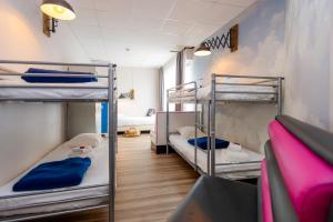 Postel nebo postele na pokoji v ubytování Hôtel Le Grand Barnum
