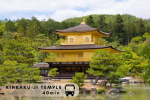 a large yellow building in the middle of a lake at Excellent Hotel - Vacation STAY 50210v in Kyoto