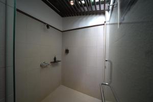 a bathroom with a shower with a glass door at Ao Prao Resort in Ko Samed