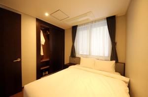 Postel nebo postele na pokoji v ubytování Pyeongchang Space hubt Hotel & Resort