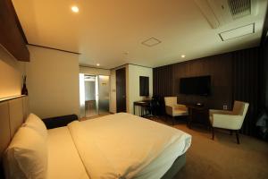 Postel nebo postele na pokoji v ubytování Pyeongchang Space hubt Hotel & Resort