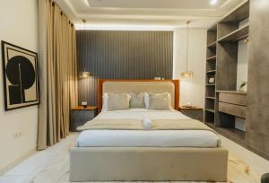 Postel nebo postele na pokoji v ubytování George Residence Kaura Abuja