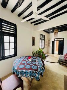 a bedroom with a bed in the middle of a room at Banana Shamba Estate in Lamu +53 photos