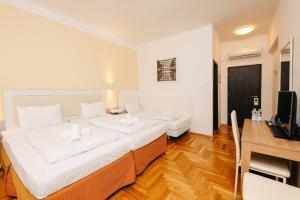 Postel nebo postele na pokoji v ubytování Hotel Metro + 20 fotografií