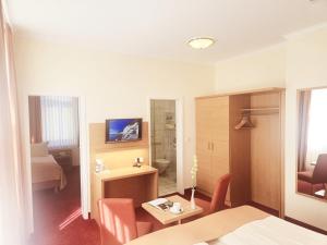 TV a/nebo společenská místnost v ubytování Hotel Villa Meeresgruss