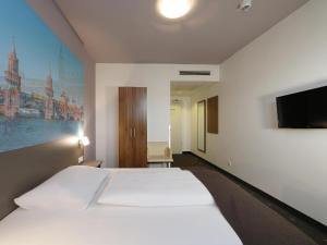 Postel nebo postele na pokoji v ubytování B&B Hotel Berlin City-Ost