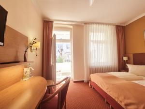 Postel nebo postele na pokoji v ubytování Hotel Villa Meeresgruss
