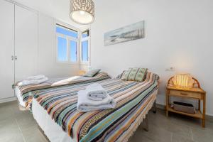 Postel nebo postele na pokoji v ubytování Hauzify I Apartament Torremunts