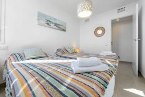 Postel nebo postele na pokoji v ubytování Hauzify I Apartament Torremunts