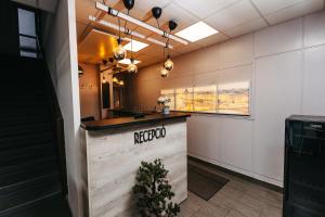 A kitchen or kitchenette at Hotel Metro