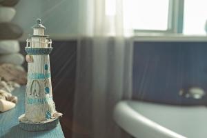 a toy lighthouse sitting on top of a table at Smithy Cottage in Heysham