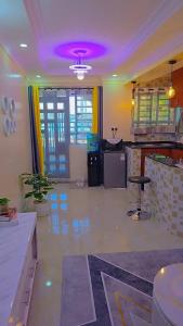 a living room with a purple ceiling and a bar at KenPam BNB in Isiolo