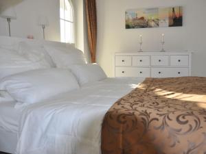 Postel nebo postele na pokoji v ubytování FeWo Relex in der Villa Dorothee