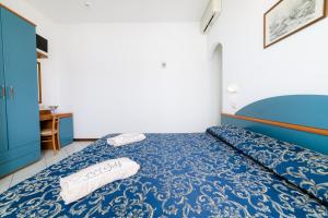 Postel nebo postele na pokoji v ubytování Hotel Golf