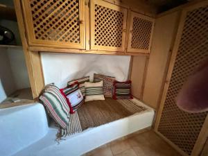 a group of pillows sitting on a shelf in a room at Casa Walhalla & Cortijo El Páramo in Pampaneira +63 photos