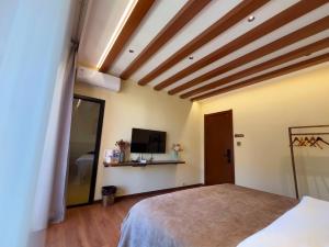 Lova arba lovos apgyvendinimo įstaigoje Luyu Shijian B&B