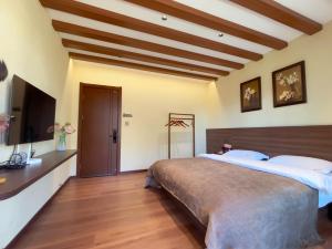 Lova arba lovos apgyvendinimo įstaigoje Luyu Shijian B&B