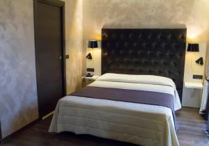 Postel nebo postele na pokoji v ubytování Hotel Continental