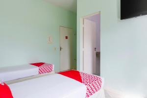 Postel nebo postele na pokoji v ubytování OYO Hotel Cosmópolis, Sao Paulo