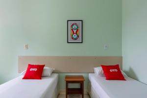 Postel nebo postele na pokoji v ubytování OYO Hotel Cosmópolis, Sao Paulo