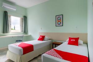 Postel nebo postele na pokoji v ubytování OYO Hotel Cosmópolis, Sao Paulo