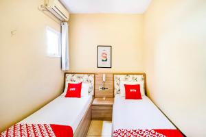 Postel nebo postele na pokoji v ubytování OYO Hotel Itarantim, São Paulo