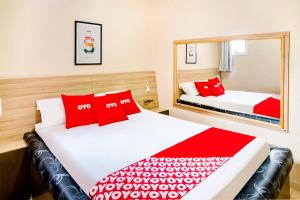 Postel nebo postele na pokoji v ubytování OYO Hotel Itarantim, São Paulo