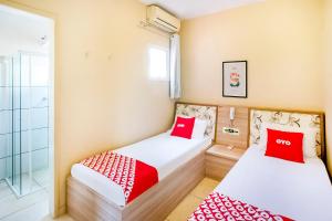 Postel nebo postele na pokoji v ubytování OYO Hotel Itarantim, São Paulo